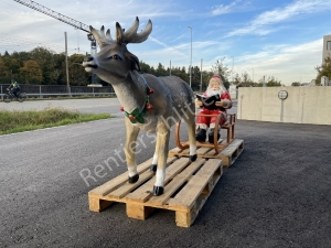 Rentier mit Schlitten und Weihnachtsmann